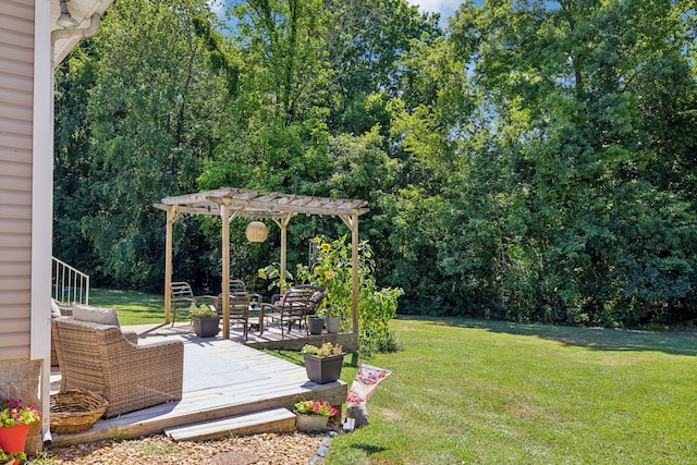 view of yard featuring a wooden deck and a pergola