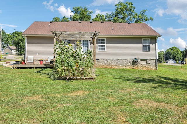 rear view of property featuring roof with shingles, a wooden deck, a yard, a pergola, and crawl space