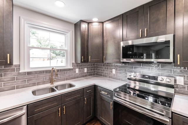1613 Tammany Dr Unit A, Nashville, TN 37206 - kitchen with appliances with stainless steel finishes, a sink, dark brown cabinets, backsplash, and recessed lighting