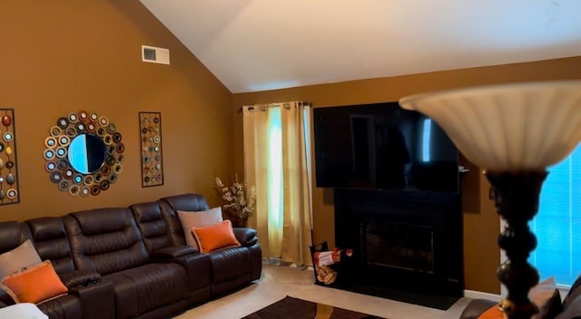 carpeted living room with vaulted ceiling, a fireplace, and visible vents