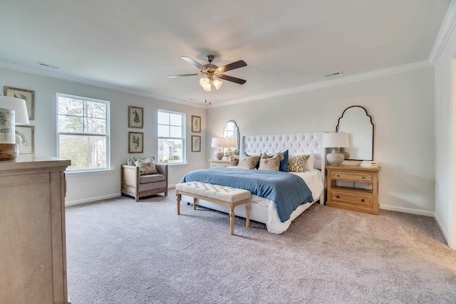 bedroom with crown molding, baseboards, and carpet floors