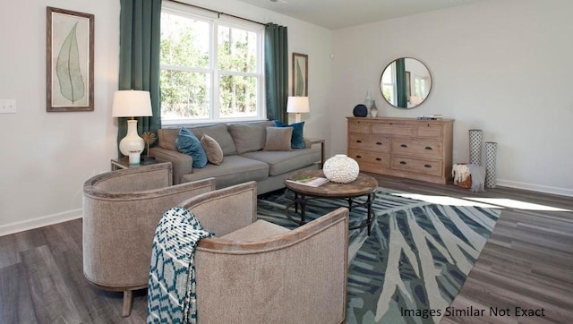 living room featuring wood finished floors and baseboards