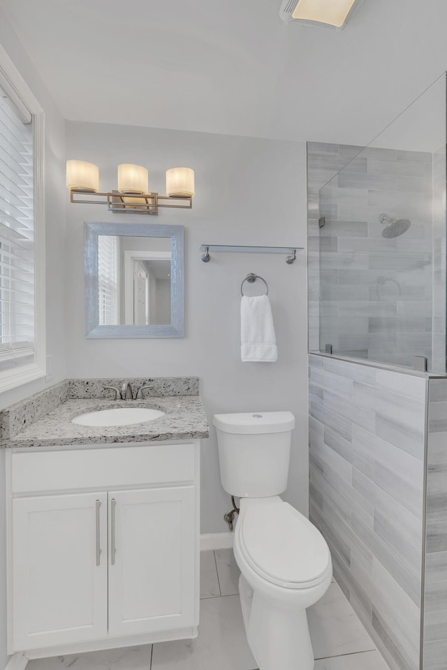 full bath featuring tile patterned floors, toilet, walk in shower, and vanity