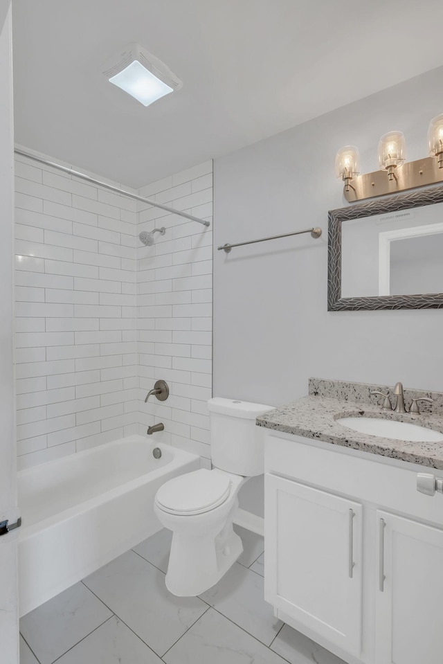 bathroom with tub / shower combination, toilet, and vanity