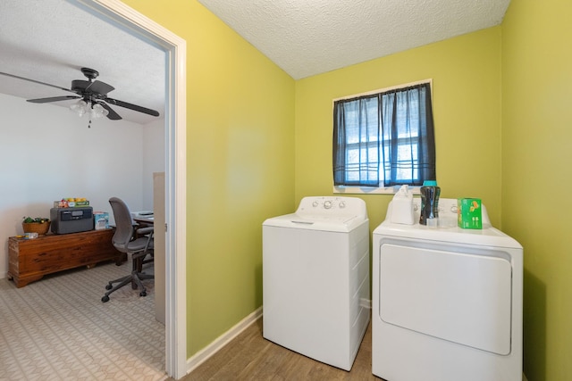 laundry room with baseboards, laundry area, washer and dryer, a textured ceiling, and a ceiling fan