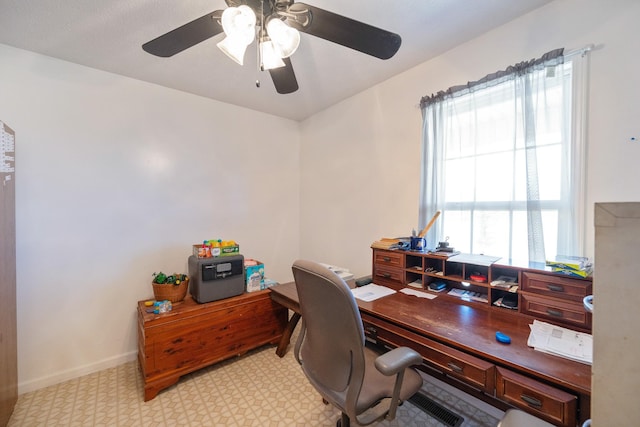 home office featuring light floors, baseboards, and ceiling fan