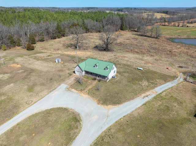 drone / aerial view with a rural view and a wooded view