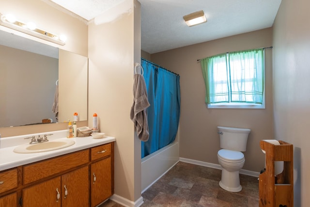 full bathroom with shower / bathtub combination with curtain, toilet, a textured ceiling, baseboards, and vanity