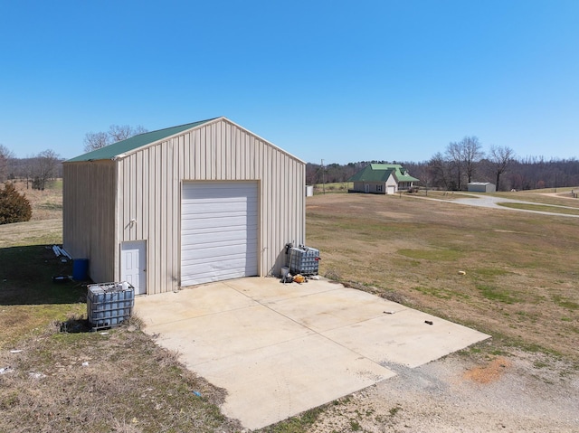 detached garage featuring driveway