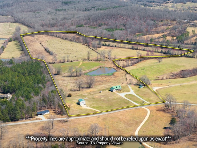 birds eye view of property with a water view and a rural view