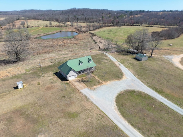 birds eye view of property with a rural view and a water view