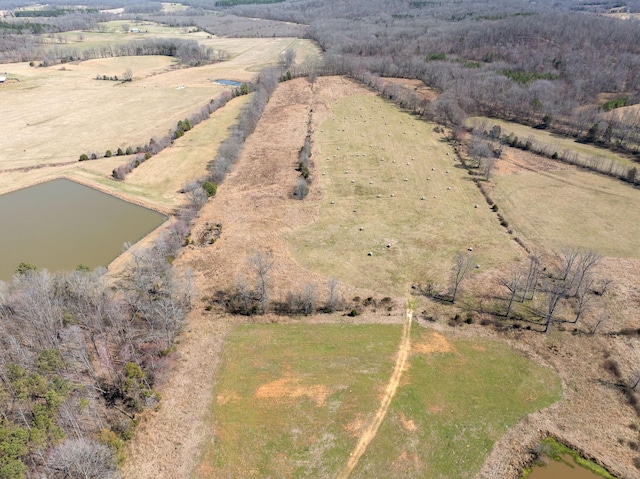 drone / aerial view featuring a rural view and a water view