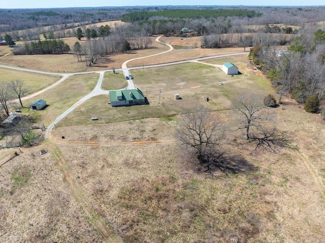 birds eye view of property with a rural view