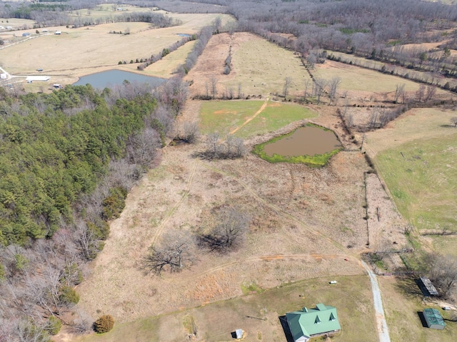 aerial view with a rural view and a water view