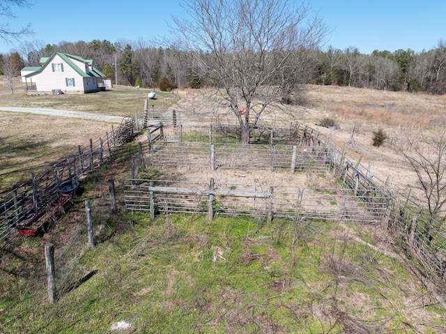 view of yard featuring a rural view and fence