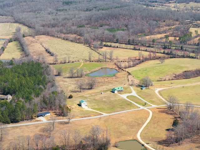 birds eye view of property with a water view and a rural view