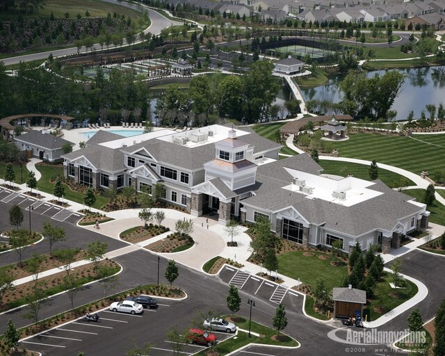 bird's eye view featuring a water view and a residential view