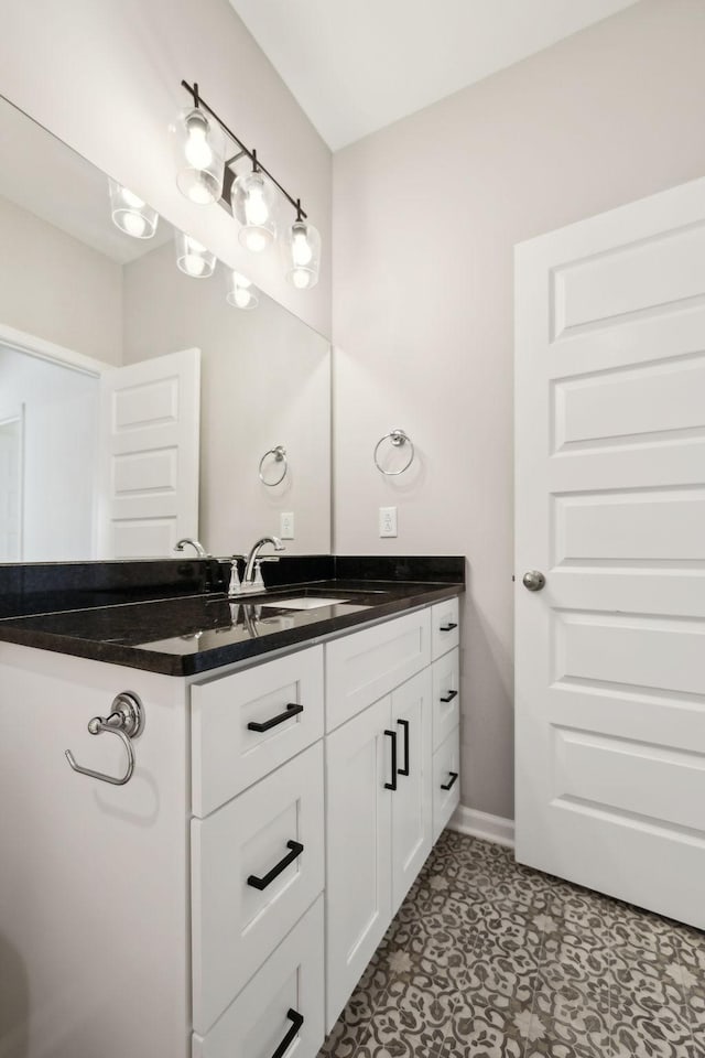 bathroom featuring vanity and baseboards