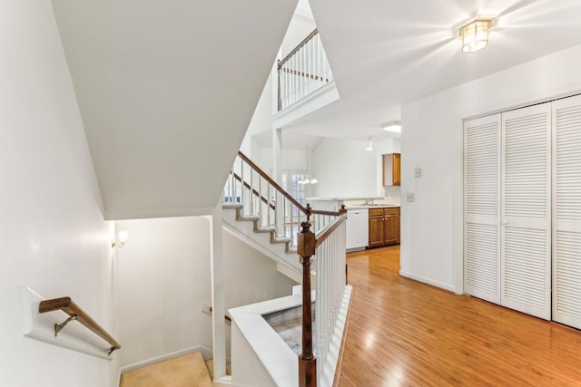 stairs featuring baseboards and wood finished floors