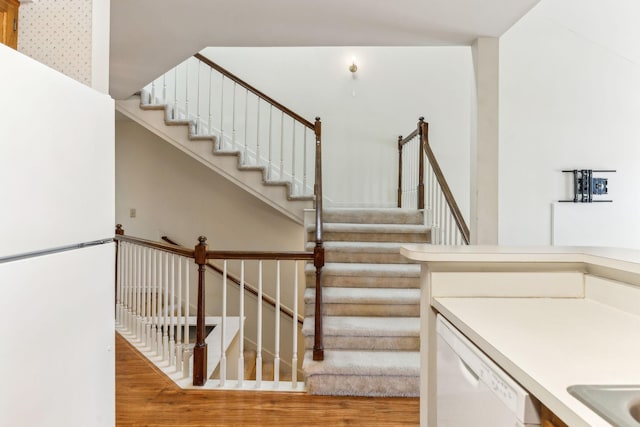 stairway with wood finished floors