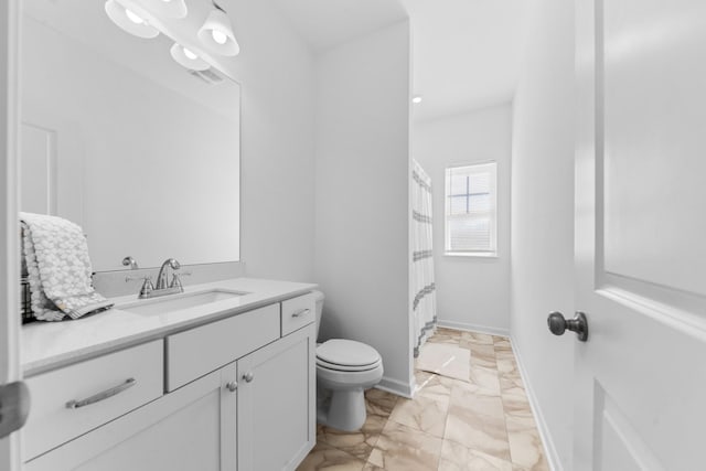 full bathroom with baseboards, toilet, a shower with shower curtain, marble finish floor, and vanity