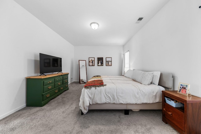 bedroom with carpet flooring, baseboards, and visible vents