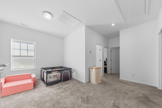 interior space featuring attic access, baseboards, and visible vents