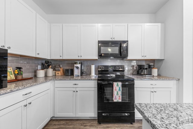 kitchen with decorative backsplash, black appliances, dark wood-style floors, and white cabinets