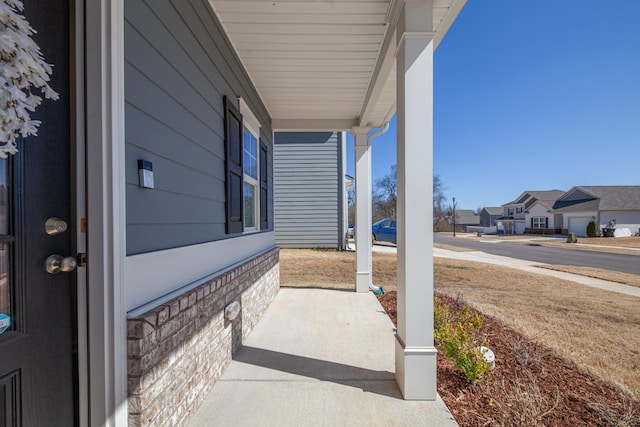 view of patio featuring a residential view and covered porch