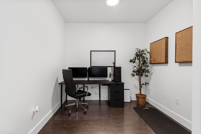 office space with wood finished floors and baseboards