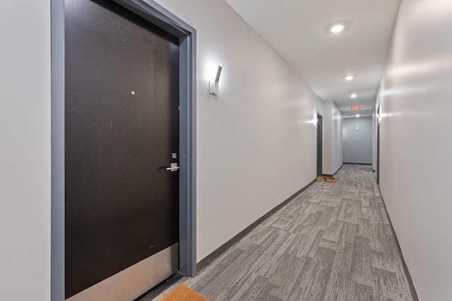 hall with light carpet and recessed lighting