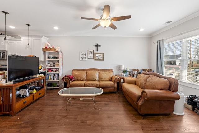 living room with a ceiling fan, dark wood-style floors, and visible vents