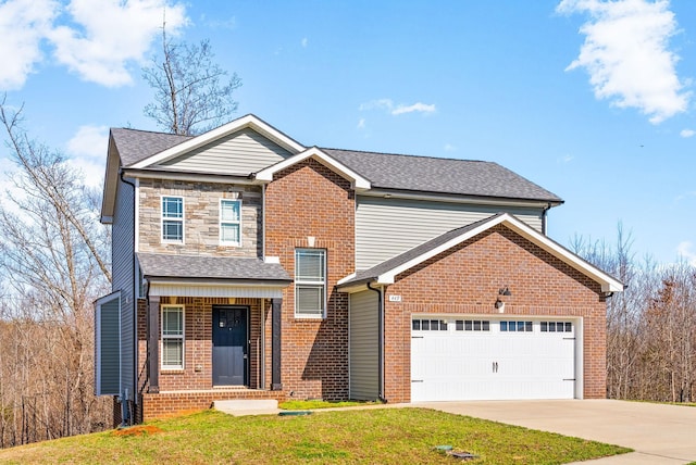 traditional home with a front lawn, an attached garage, brick siding, and concrete driveway