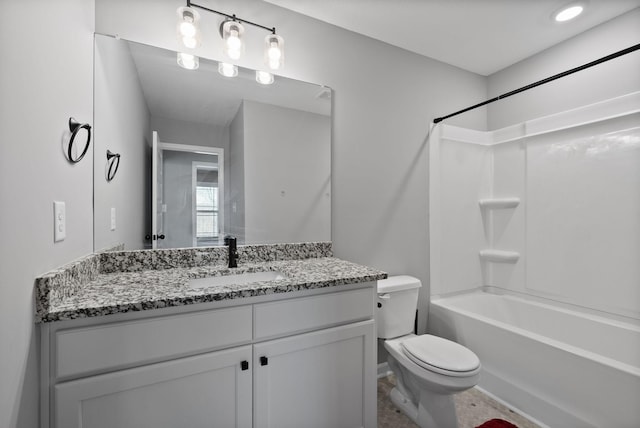 bathroom with shower / tub combination, toilet, and vanity