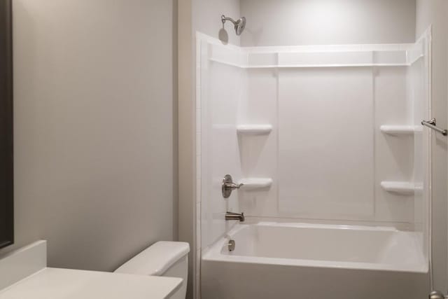 full bath featuring shower / washtub combination, toilet, and vanity