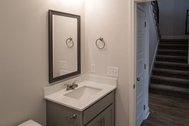 bathroom with vanity and wood finished floors