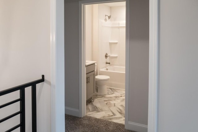 full bathroom with baseboards, toilet, bathtub / shower combination, and vanity