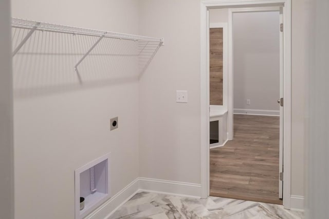 washroom with laundry area, baseboards, marble finish floor, and electric dryer hookup