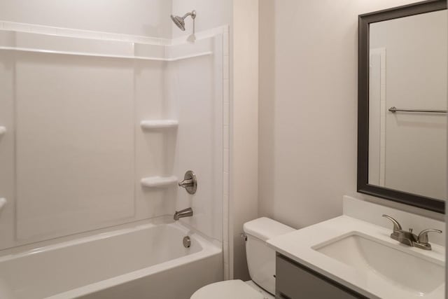 bathroom with tub / shower combination, toilet, and vanity