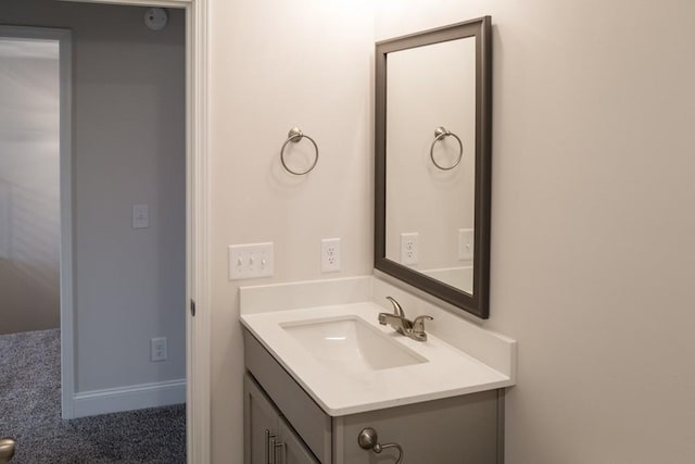 bathroom with vanity and baseboards