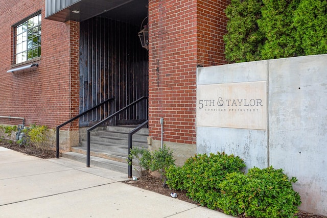 entrance to property with brick siding