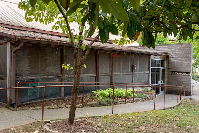 view of property exterior featuring brick siding