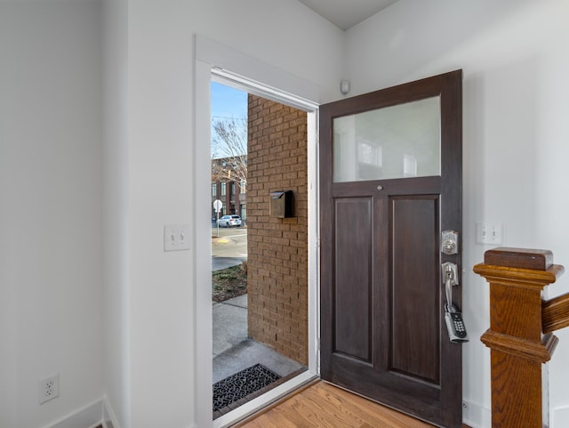 entryway with light wood finished floors