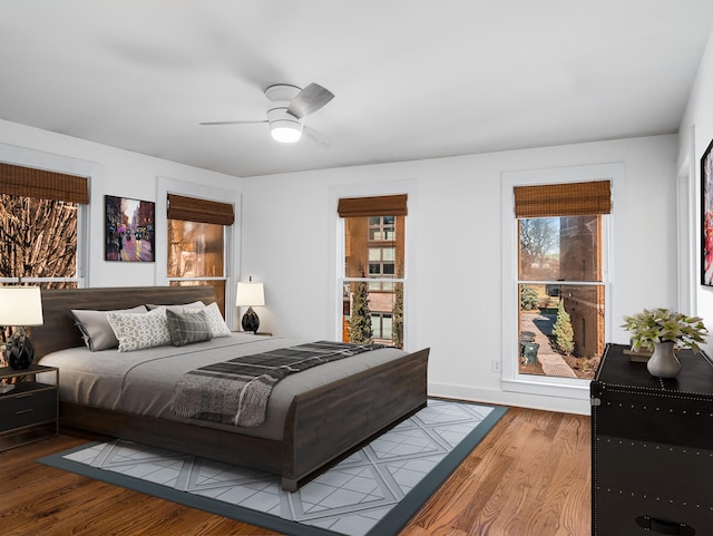 bedroom featuring a ceiling fan and wood finished floors