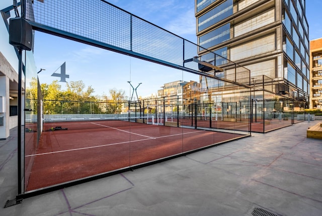 view of tennis court with fence