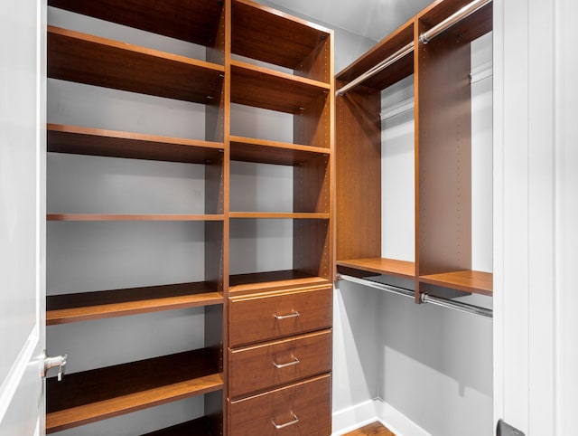 spacious closet with built in desk