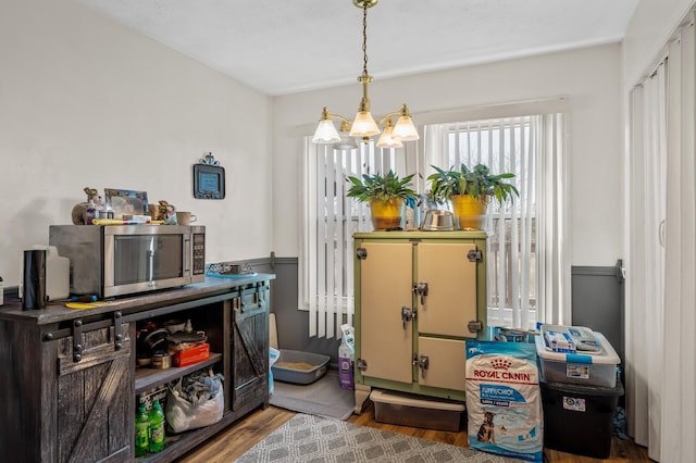 interior space with an inviting chandelier and wood finished floors