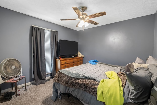 bedroom with light colored carpet, baseboards, and ceiling fan