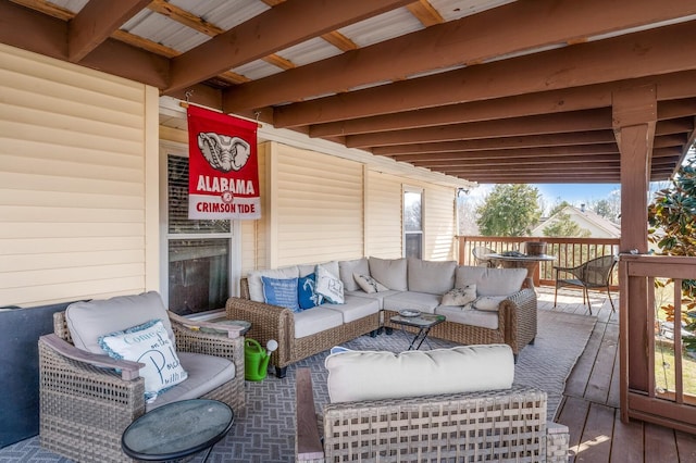 wooden terrace with an outdoor hangout area