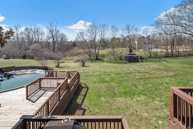 view of yard with a deck and fence